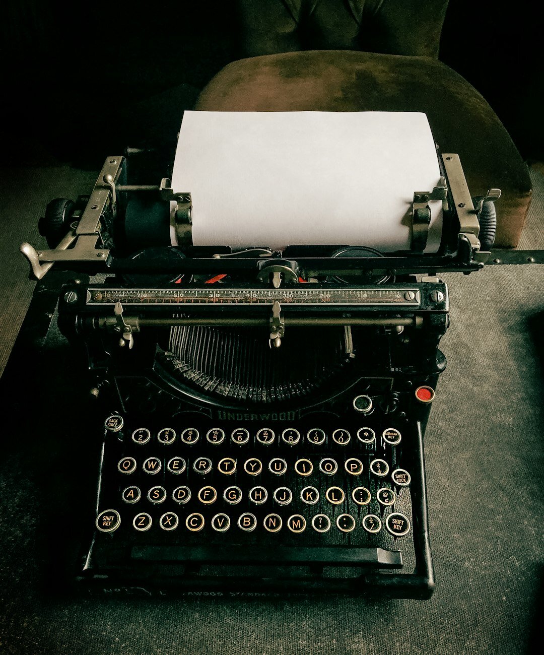 Close up of a vintage typewriter with a sheet of paper