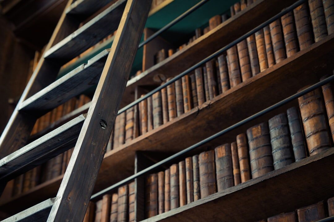 Old library with tall wooden bookshelves