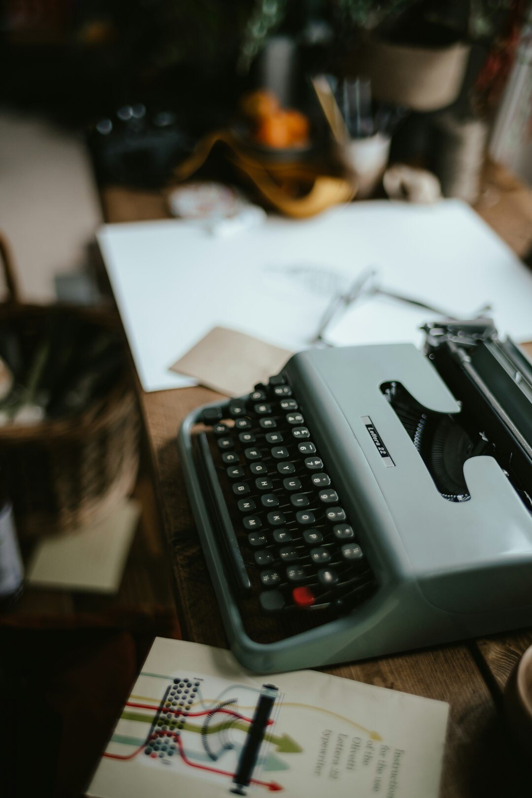 Croatian author writing at an old wooden desk by lamplight