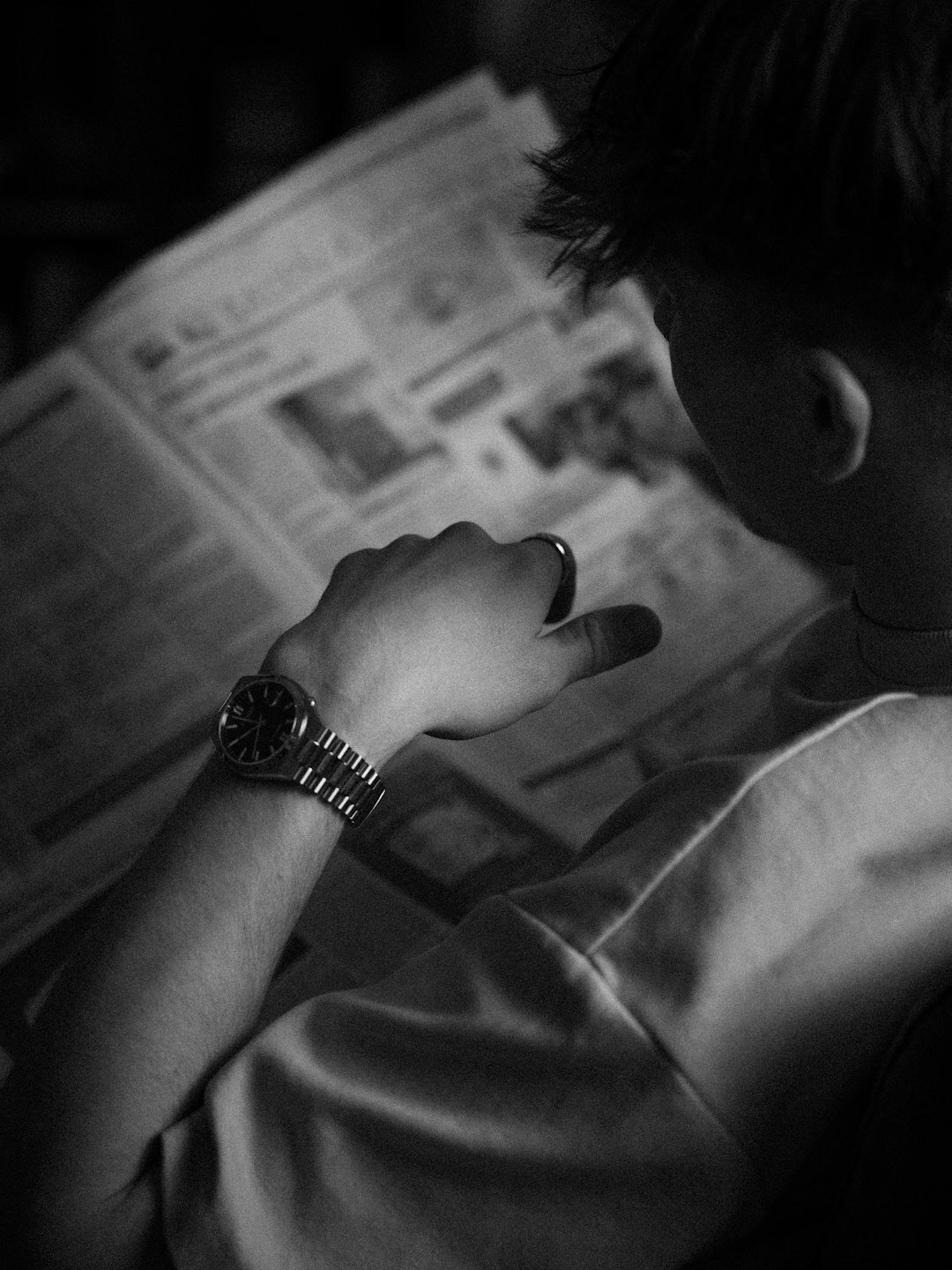 writer reading old newspaper